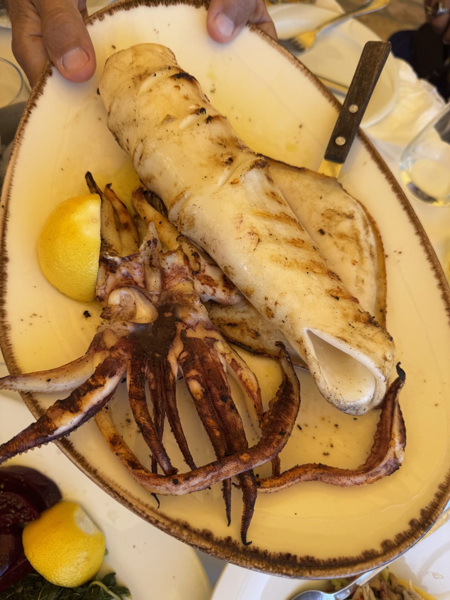 Seafood dish featuring grilled calamari