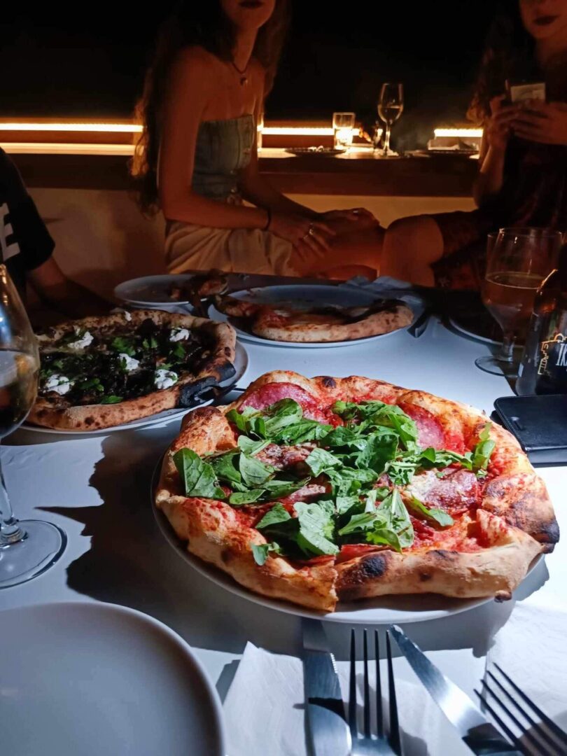 Evening meal with pizza and wine